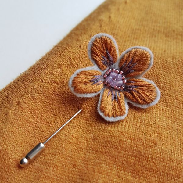 Hand embroidered brooch example