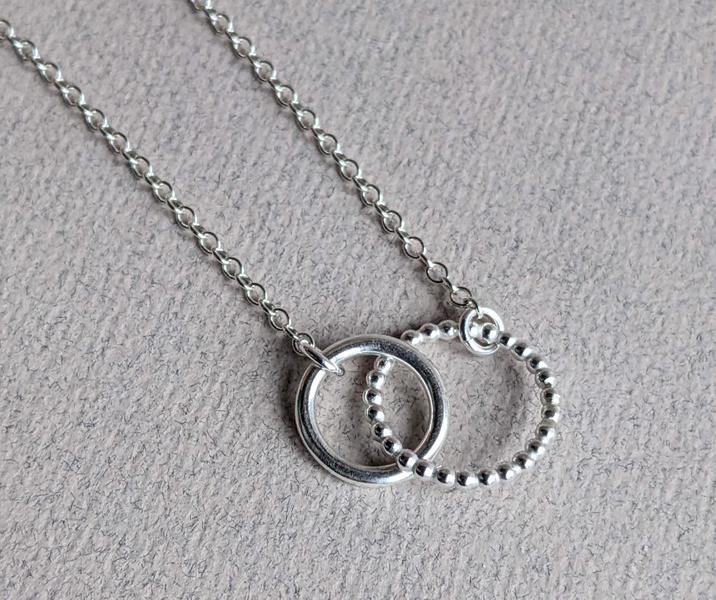 'Mother Daughter' necklace, with an everlasting circle interlinked with the other to symbolise each individual
