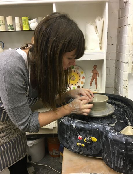 Student  throwing a small bowl for the 1st time