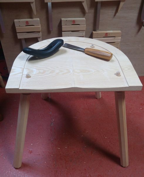 Saddling the seat with hand tools
