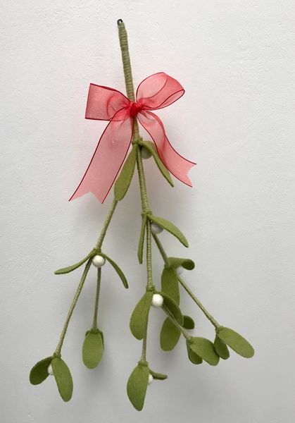 Sprig of everlasting mistletoe topped off with red organza ribbon