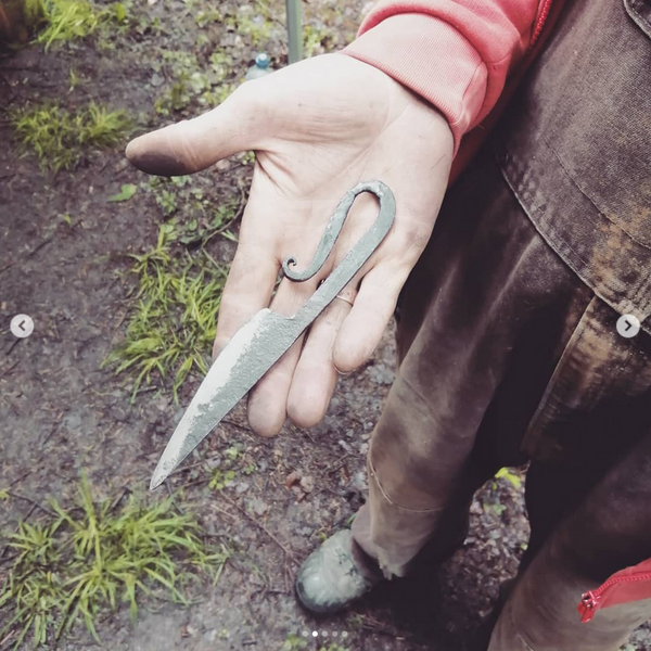 The 'blacksmith's' style of blade with a forged steel handle