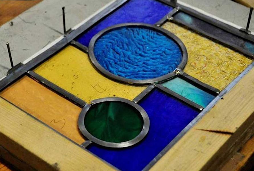 Leaded stained glass panel in progress.