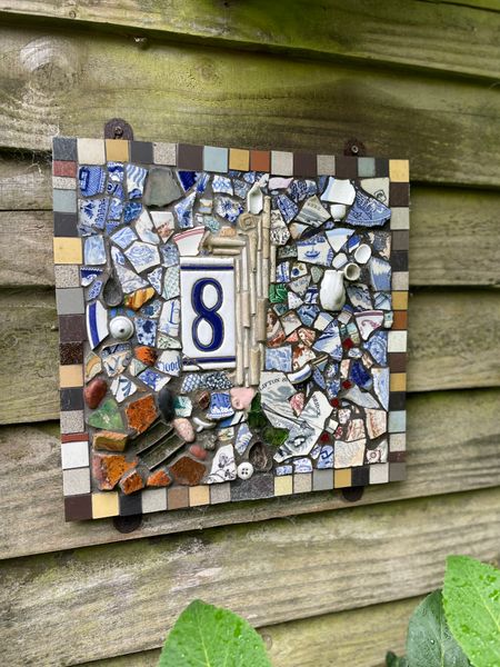 Mixed material mosaic house number