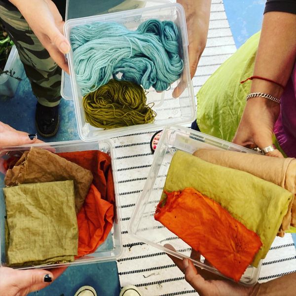 Students dyed fabric and yarn at the end of the workshop. They decided to divide their dye materials and share dye pots.