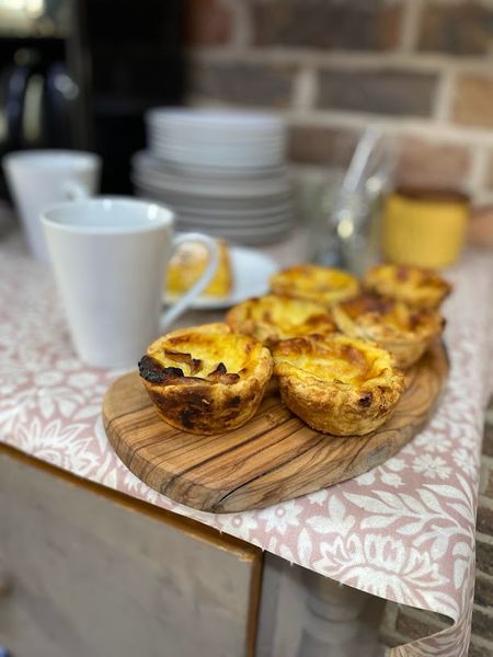 Alison's legendary Portugese Custard Tarts, warm out of the oven which is downstairs in The Oast Bakery!
