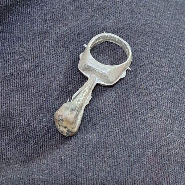 Silver signet ring casting - with sprue still attached - ready for cleaning up
