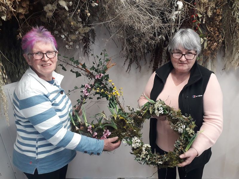 A couple of delighted ladies with their completed wreath
