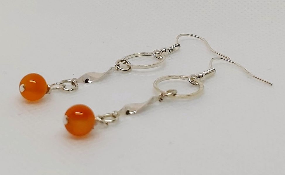 Orange carnelian - a rich orange with silver making the carnelian really stand out above the rest when worn.