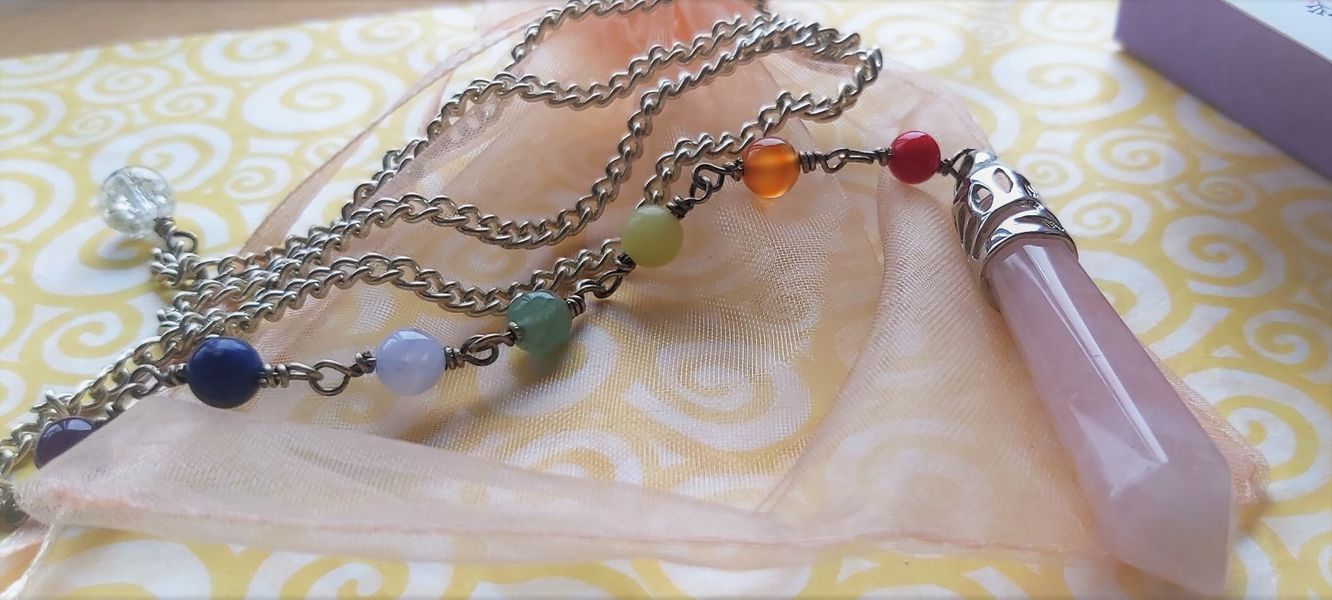 SEVEN GEMSTONES HAND CRAFTED WITHIN THE PENDULUM