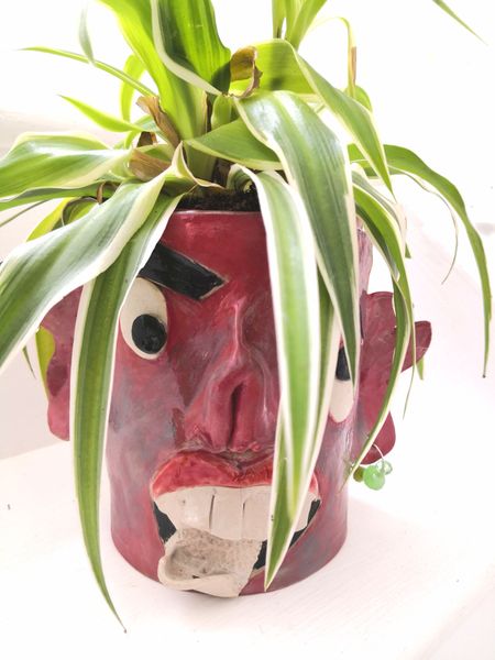 Grotesque plant pot