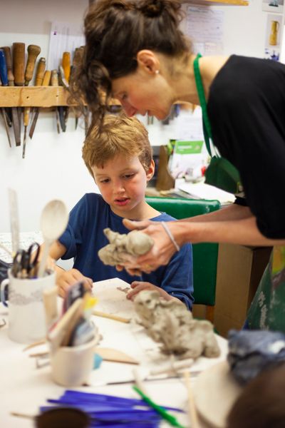 Children making monsters in clay