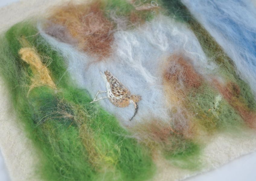 Side view of embroidered curlew on a needle felted coastal landscape: Credit Hobbz Designs