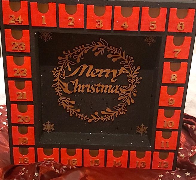 "Merry Christmas" wording and Four Snowflakes can be seen on a Black Glitter background