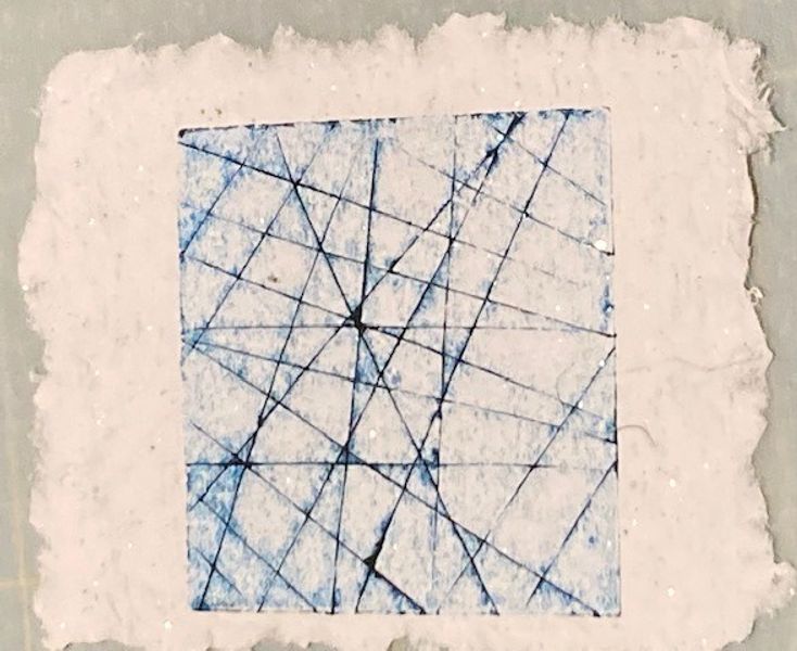 Blue lines on handmade paper