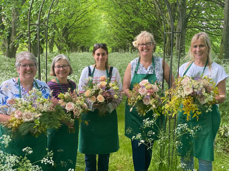 Having great fun and laughs making bouquets!