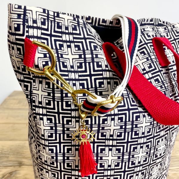 Sustainable handbag made from a vintage kimono with a redd tassel