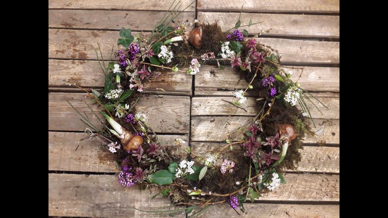 Living Flowering Wreath with Spring Bulbs and blossom on a moss base
