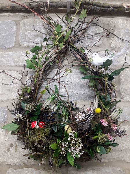 The tear drop/Egg Shaped Wreath is easily adapted into an Easter Wreath with a touch of seasonal decor.
