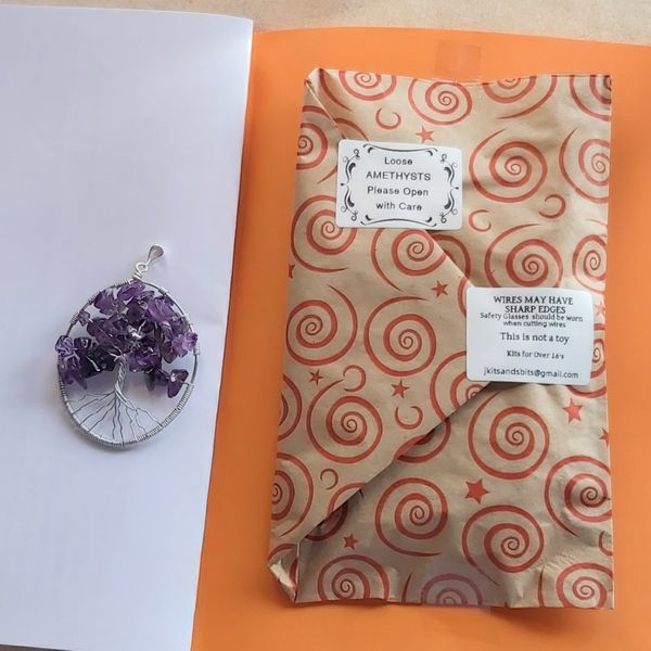 You will receive your Tree of Life Kit in an A5 format which opens to A4 with the silver and amethyst required tucked safely at the back of the book of instructions.