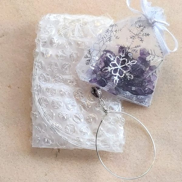 Contents of the recycled envelope or paper bag at the reverse of the instructions holds the wire, pre-cut ready to use, and the bag of Amethysts too.