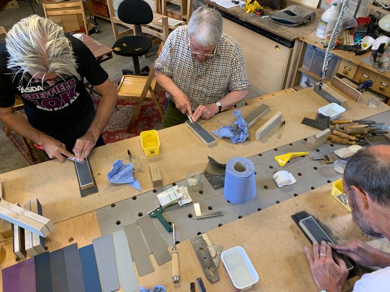 Busily flattening the back of the chisel