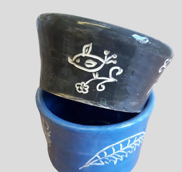sgraffito design on thrown pots