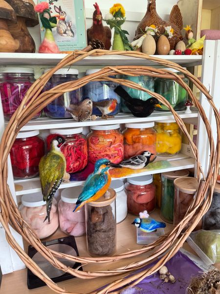 A selection of Cecily Kate's needle felted British birds happily perching in her studio