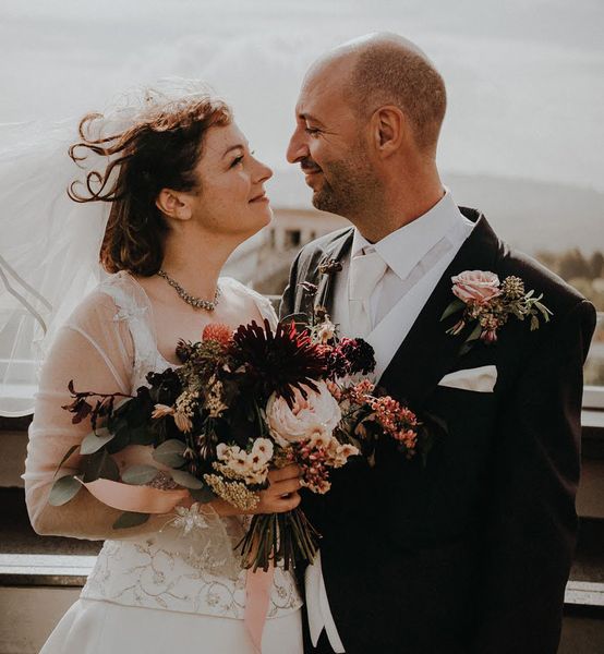 bride and groom with wedding bouqet