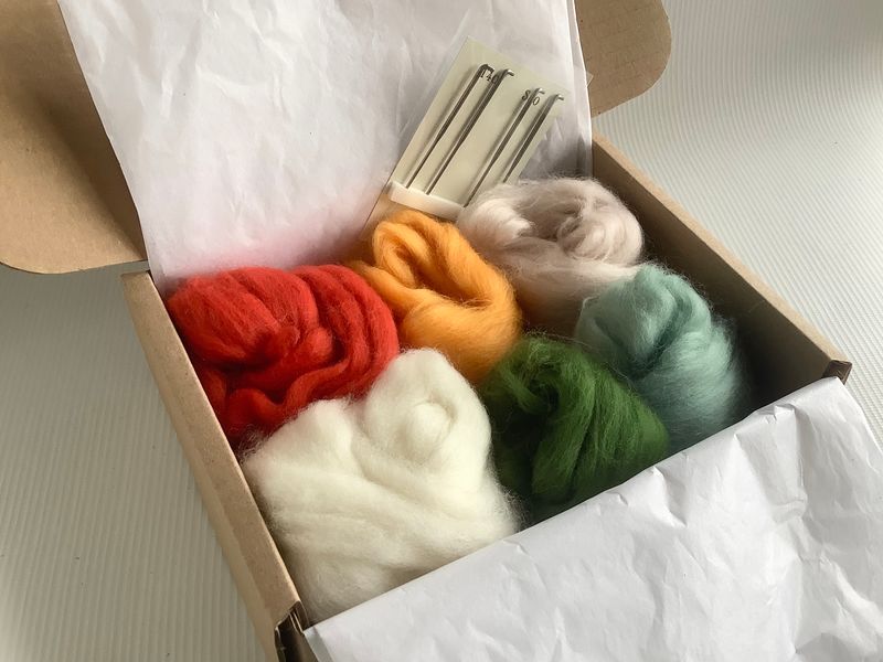 A generous amount of wools so that you can make more little toadstools when the workshop is over and four felting needles on a card holder. 