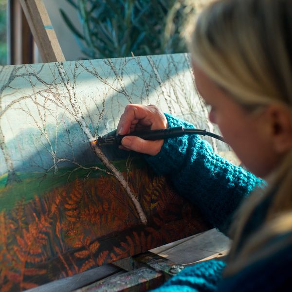 Ruth working on an Autumn Woodland scene ( pyro and paint technique)
