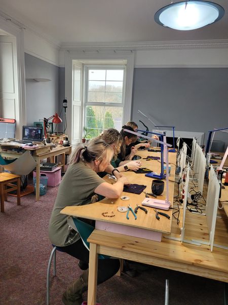 Course attendees making jewellery in the Studio