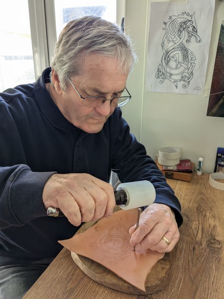 Terry tooling the leather with a stamp