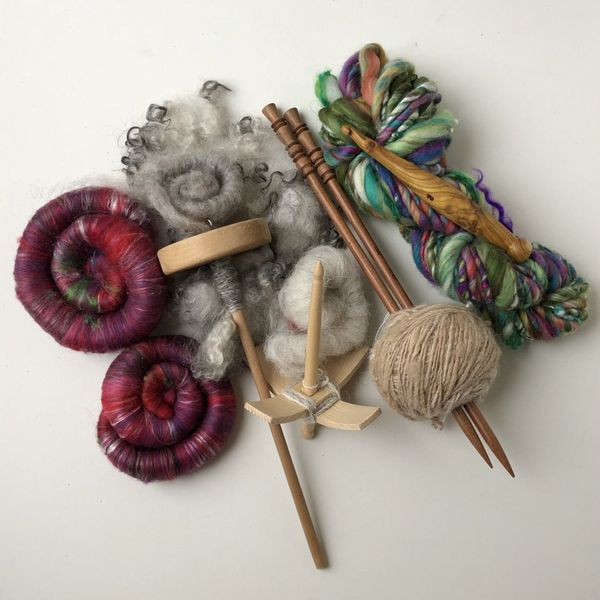 Fibre, drop spindle, spun yarn with knitting needles, spinning stick and more hand spun yarn!