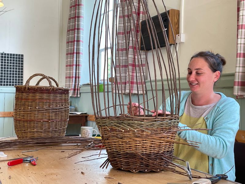 Creating log basket at a 2 Day Traditional English Round Willow Basket Workshop