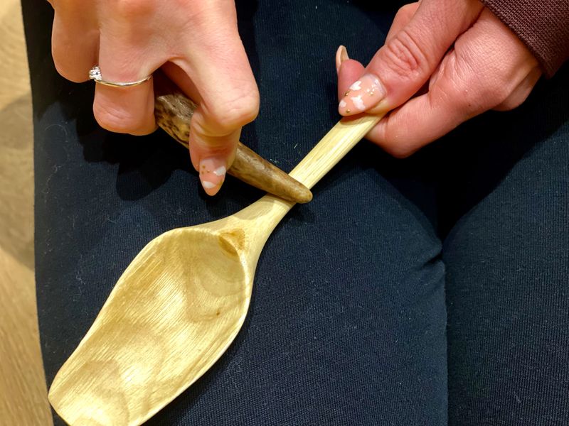 Burnishing a spoon for finishing using a deer antler tine