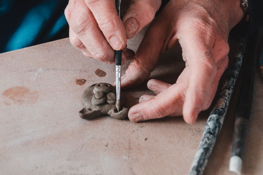 Learning to use many types of tools to shape the clay