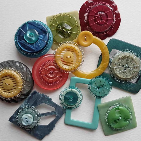Brooches made with vintage haberdashery and coloured wire