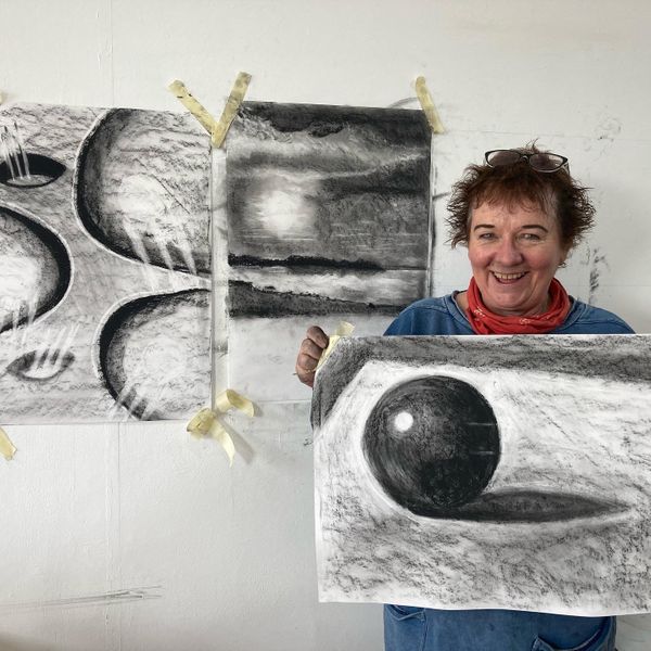 Pippa with her three drawings 
