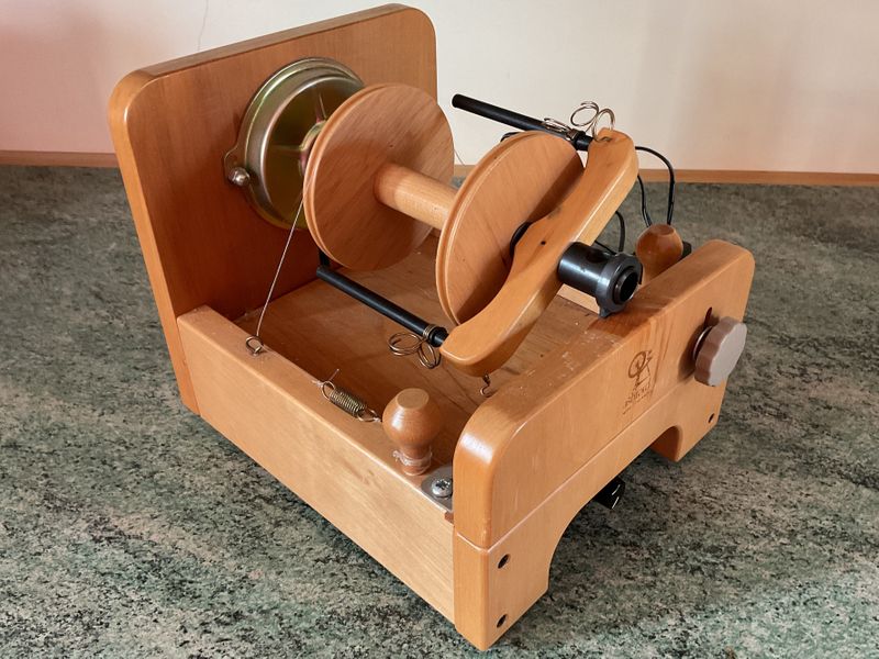 An electrically powered spinning wheel.