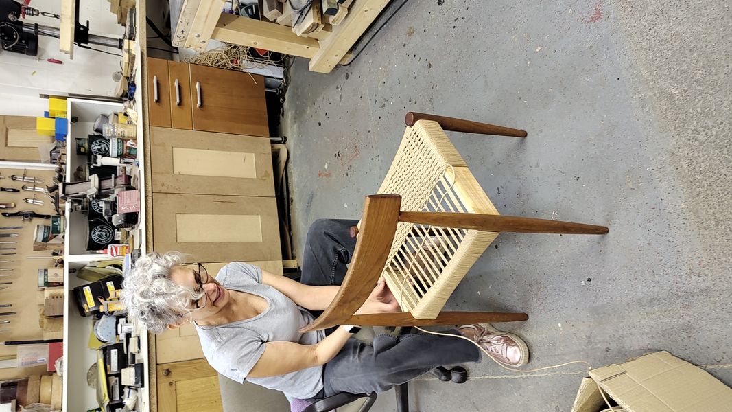 Student weaving there own chair as a restoration project.