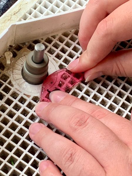 Smoothing the glass on the grinder