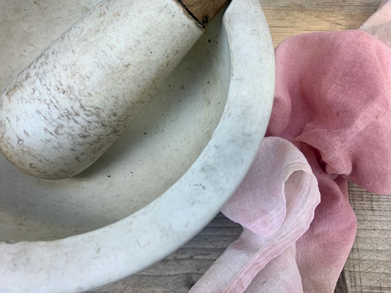 Pestle and mortar with muslin cloth for straining dyestuffs 