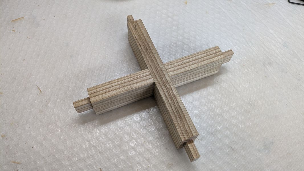 Four finished tenons and a cross halving joint