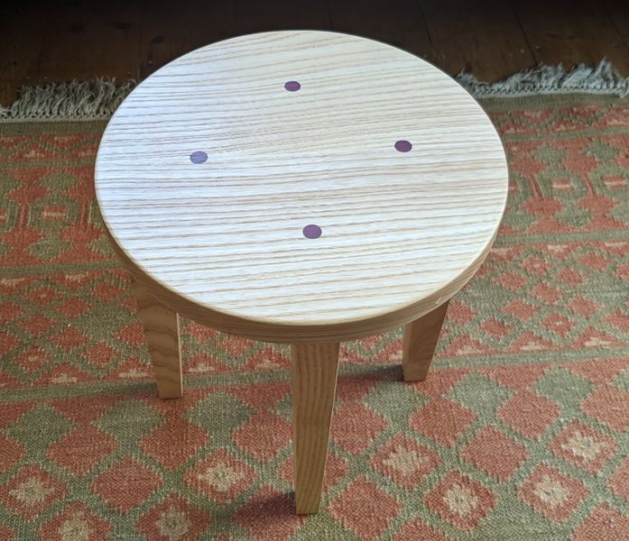 The finished tabble / stool from above showing dcorative plugs in Purpleheart wood