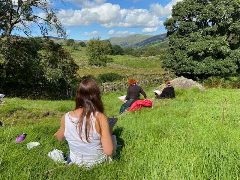 Students painting in the landscape at Cowshed Creative