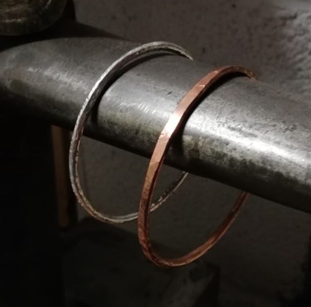 Silver bangle with a copper bangle