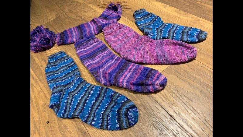 Selection of socks knitted by attendees on sock knitting workshop. 