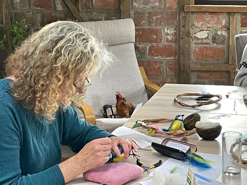 A student busy needle felting on the Blue Tit and Blossom Hoop workshop at The Oast Studio
